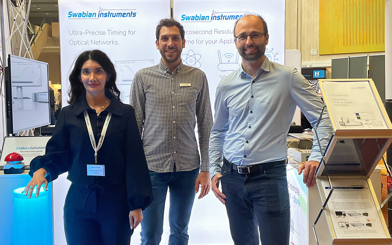 Swabian Instruments team standing at their booth during DPG Fall Meeting 2025 in Göttingen.