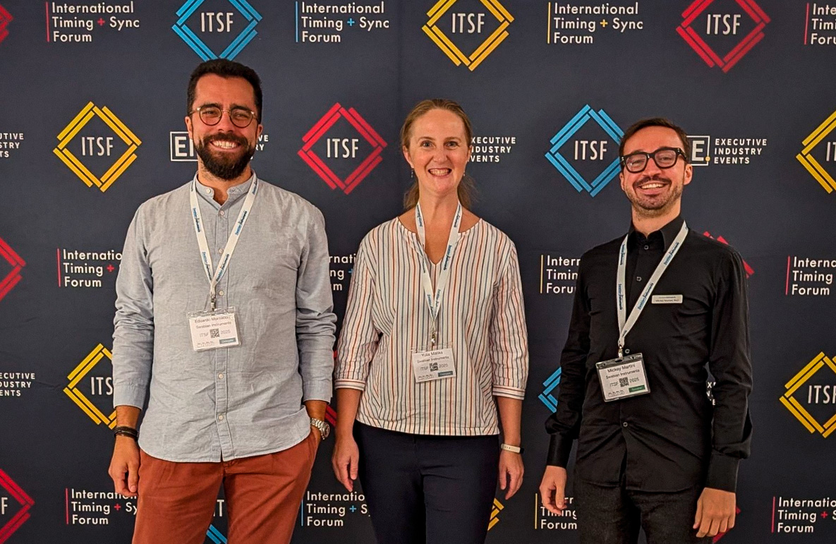 The Swabian Instruments team in front of a decorative wall for ITSF show. Left to right includes three team members of Swabian Instruments Edoardo Mornacchi, Yuia Matiks, Mickey Martini.